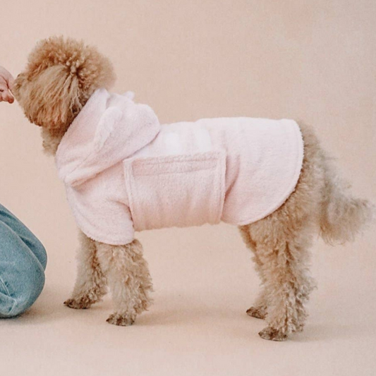 pink dog drying bathrobe